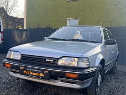 Grau Gebraucht 1989 Mazda 323 Kleinwagen | 3.499 €