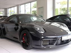 Tiefschwarzmetallic Gebraucht 2024 Porsche 911 Carrera 4 GTS Coupé | 143.800 € (Fairer Preis)