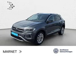Indiumgrau metallic/schwarz Gebraucht 2024 VW T-Roc Style SUV | 28.430 € (Guter Preis)