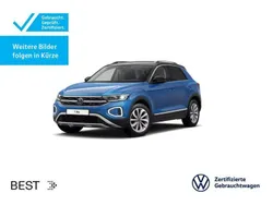 Ravennablau metallic/schwarz (metallic) Gebraucht 2024 VW T-Roc Style SUV | 29.449 € (Guter Preis)