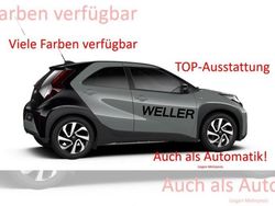 Grün (ginger beige metallic, dach mysticschwarz mic) Gebraucht 2024 Toyota Aygo X Team SUV | 18.070 € (Fairer Preis)