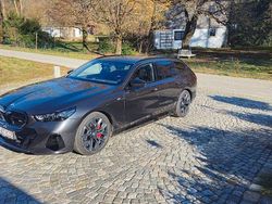 Grau Gebraucht 2024 BMW i5 Performance Kombi | 83.601 €