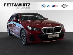 Fire red metallic Gebraucht 2024 BMW 530e M Sport Kombi | 67.700 €
