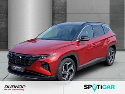 Sunset red / phantom black / m Gebraucht 2021 Hyundai Tucson Prime SUV | 27.490 € (Fairer Preis)