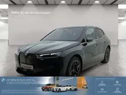 Grau Gebraucht 2024 BMW iX Sport Line SUV | 60.907 € (Etwas zu teuer)