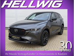 Machine grey metallic (metallic) Gebraucht 2024 Mazda CX-5 Homura-Line SUV | 36.580 € (Guter Preis)
