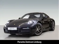 Tiefschwarzmetallic Gebraucht 2024 Porsche 911 Carrera Coupé | 127.790 € (Fairer Preis)
