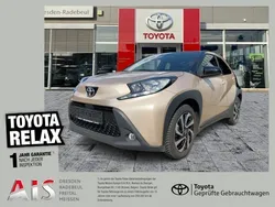 Ginger beige (4u9)/ black mica Gebraucht 2023 Toyota Aygo Pulse Kleinwagen | 15.770 € (Guter Preis)