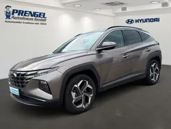 Silky bronze / met Gebraucht 2024 Hyundai Tucson Trend SUV | 33.650 €