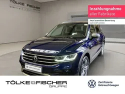 Atlantic blue (metallic) Gebraucht 2024 VW Tiguan Allspace Elegance SUV | 42.799 € (Guter Preis)