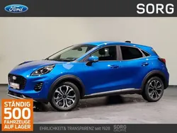 Blau, desert island blue metallic Gebraucht 2024 Ford Puma Titanium SUV | 24.250 € (Guter Preis)