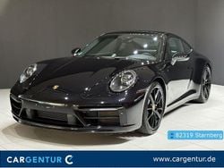 Tiefschwarz (metallic) Gebraucht 2024 Porsche 911 Carrera 4 Coupé | 129.992 € (Fairer Preis)