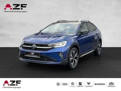 Reef blue metallic / schwarz Gebraucht 2024 VW Taigo Style SUV | 25.890 € (Fairer Preis)