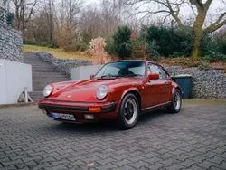 Granatrotmetallic Gebraucht 1986 Porsche 911 Carrera Coupé | 66.911 €