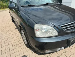 Grau Gebraucht 2004 Kia Carens 2 Van / Kleinbus | 500 € (Guter Preis)