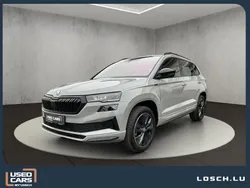 Grau Gebraucht 2024 Skoda Karoq SportLine SUV | 37.490 € (Fairer Preis)