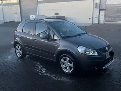 Grau Gebraucht 2010 Suzuki SX4 Comfort Limousine | 5.899 € (Fairer Preis)