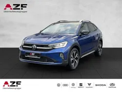 Reef blue metallic / schwarz Gebraucht 2024 VW Taigo Style SUV | 27.890 € (Fairer Preis)