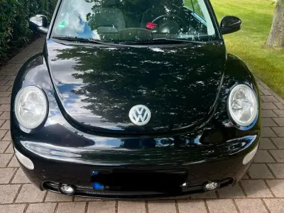 Gebraucht VW New Beetle 75 PS (55 kW) 2004 Schwarz Kleinwagen