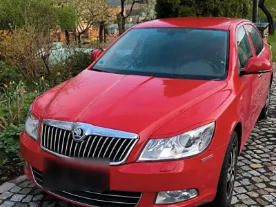 Używany Skoda Octavia Family 140 KM (102 kW) 2011 Czerwony Sedan/Limuzyna