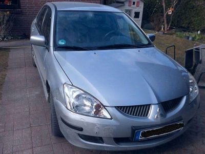 Second-hand Mitsubishi Lancer Comfort Edition 98 CP (72 kW) 2004 Argintiu Berlinǎ