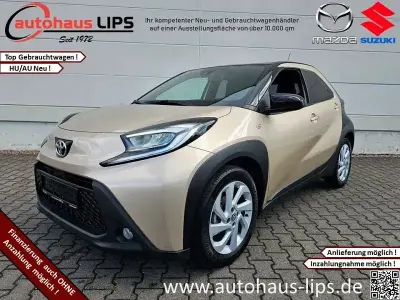 Gebraucht Toyota Aygo X Pulse 72 PS (52 kW) 2022 Ginger beige (4u9)/ black mica (209) SUV