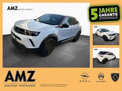 Gebraucht Opel Mokka-e GS Line 100 kW (136 PS) 2023 Lack weiss banquise/typ aussen SUV