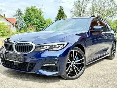 Gebraucht BMW 330e M Sport 292 PS (214 kW) 2021 Tansanitblau ii metallic Kombi