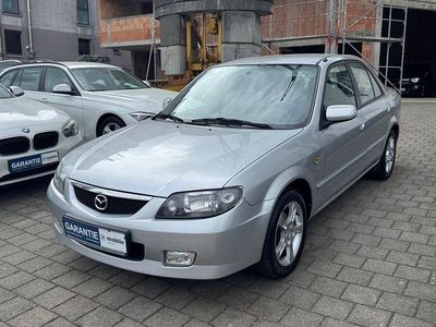 Usado Mazda 323S Exclusive 95 HP (69 kW) 2002 Prateado Sedan