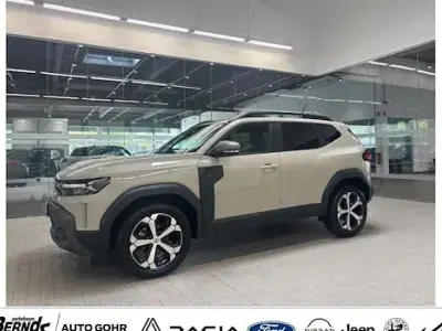 Gebraucht Dacia Duster Journey 141 PS (103 kW) 2025 Sandstone metallic SUV
