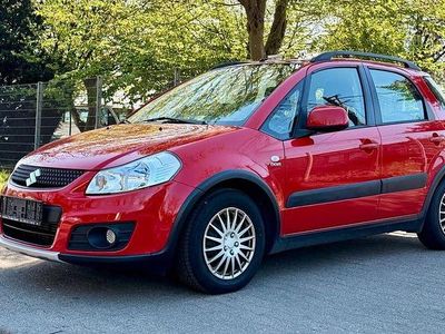 Second-hand Suzuki SX4 135 CP (99 kW) 2012 Roșu Berlinǎ