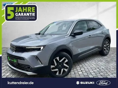 Gebraucht Opel Mokka-e Elegance 100 kW (136 PS) 2022 Kontrast grau/quarz silber SUV