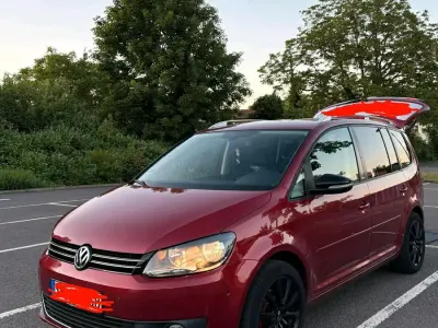 Gebraucht VW Touran Style 105 PS (77 kW) 2011 Rot Van / Kleinbus