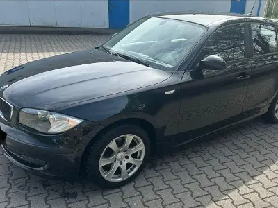 Gebraucht BMW 116 122 PS (89 kW) 2009 Schwarz Kleinwagen