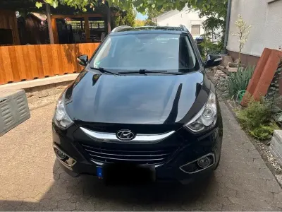 Gebraucht Hyundai Tucson 163 PS (119 kW) 2012 Schwarz SUV