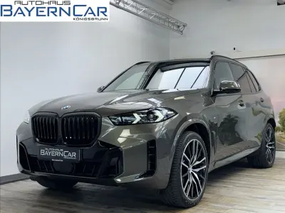 Gebraucht BMW X5 M Sport 298 PS (219 kW) 2025 (0c3d) manhattan green metallic SUV