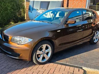 Używany BMW 116 122 KM (89 kW) 2011 Brązowy Hatchback