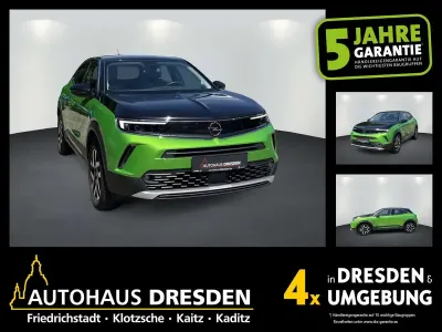 Gebraucht Opel Mokka-e Elegance 100 kW (136 PS) 2022 Matcha green SUV