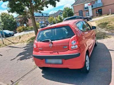 Gebraucht Nissan Pixo 77 PS (56 kW) 2010 Rot Kleinwagen