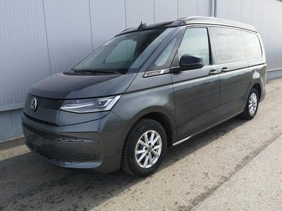 Gebraucht VW T7 Comfortline 150 PS (110 kW) 2024 Mediumblau metallic dach schwarz Van