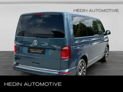 Gebraucht VW Caravelle Comfortline 150 PS (110 kW) 2019 Bambusgarden green Van
