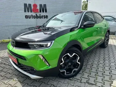 Gebraucht Opel Mokka-e Ultimate 100 kW (136 PS) 2021 Matcha green/ikone gruen SUV