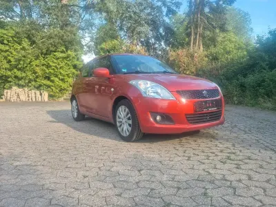 Gebraucht Suzuki Swift Basic 94 PS (69 kW) 2011 Orange Kleinwagen