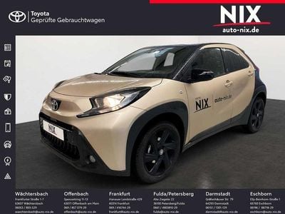 Gebraucht Toyota Aygo X Team 72 PS (52 kW) 2024 Ginger beige metallic/ night sky black SUV