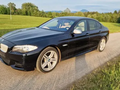 Używany BMW M550 Comfort Edition 381 KM (280 kW) 2012 Czarny Sedan/Limuzyna
