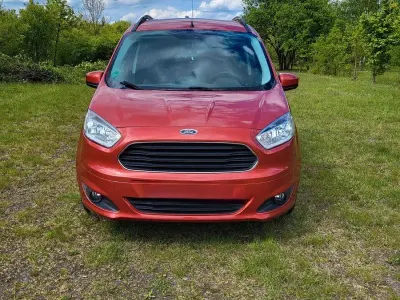 Gebraucht Ford Tourneo Courier Trend 101 PS (74 kW) 2015 Rot Van / Kleinbus