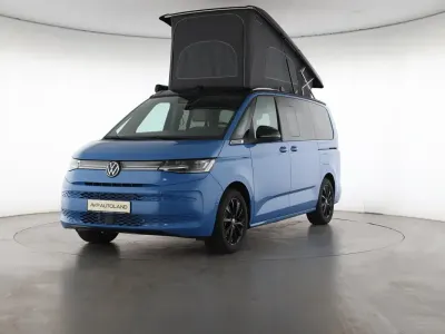Gebraucht VW T7 Beach 245 PS (180 kW) 2026 Medium blue / deep black perleff Van