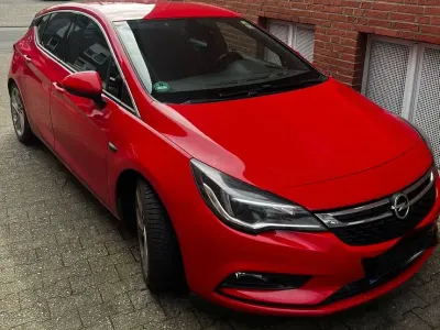 Używany Opel Astra Dynamic 150 KM (110 kW) 2015 Czerwony Sedan/Limuzyna