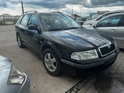 Używany Skoda Octavia 110 KM (80 kW) 2003 Czarny Kombi