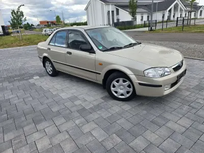 Gebraucht Mazda 323 Comfort 88 PS (64 kW) 1999 Grau Limousine